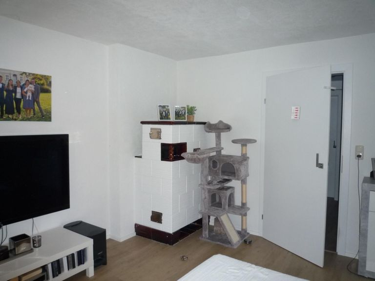 Wohnzimmer Kachelofen Wohnung 1