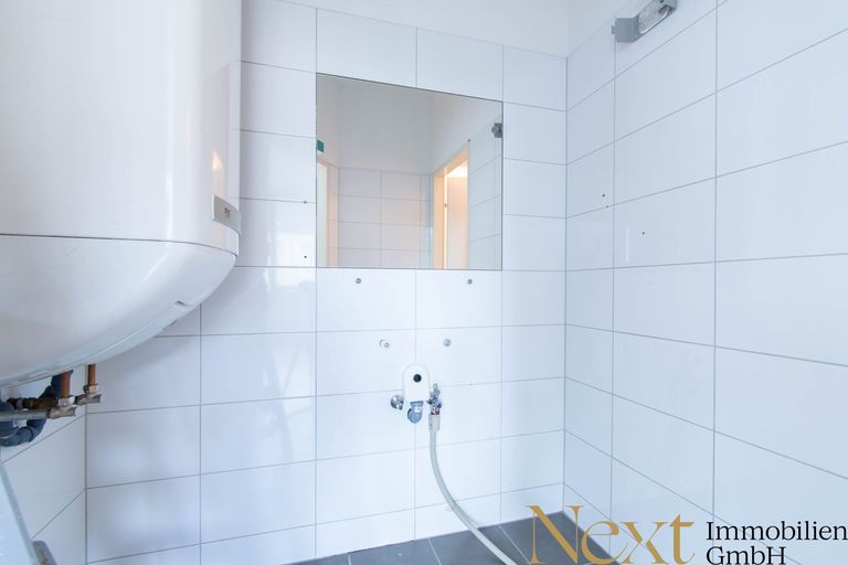 Sanitärraum mit Waschmaschinenanschluss